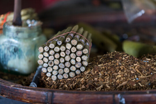Detail shot of bundle of Burmese cigars and tobacco in workshop, Lake Inle, Myanmar