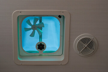 Travel trailer camper van exhaust vent with fan next to HVAC outlet in ceiling to let out moisture...