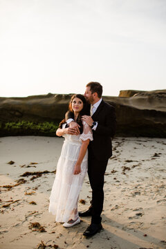 Newlyweds on Beach at Sunset in San Diego