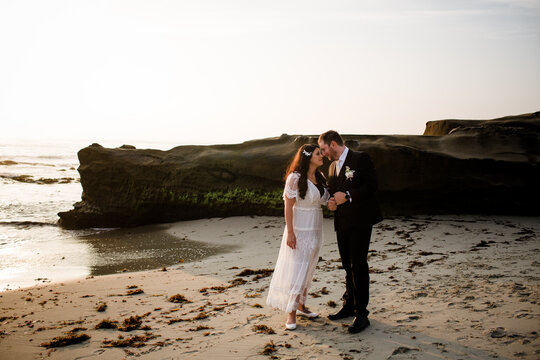 Newlyweds on Beach at Sunset in San Diego