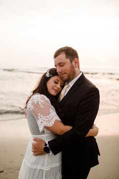 Newlyweds Posing on Beach at Sunset in San Diego