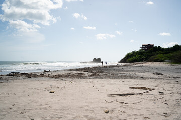 people going to surf on the beach