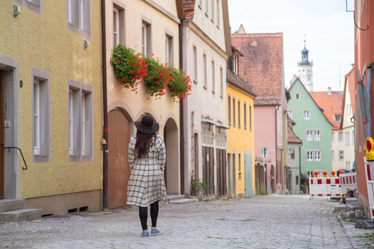 A girl wanders the modern yet medieval streets of Europe.