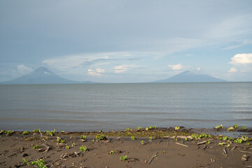lake in the mountains with volcanos in the background