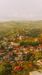 Beautiful morning landscape view of countryside hills with village houses in Dago, Bandung, West Java, Indonesia