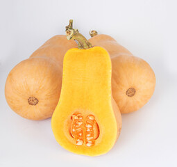 Three pumpkin pear-shaped on a light background.