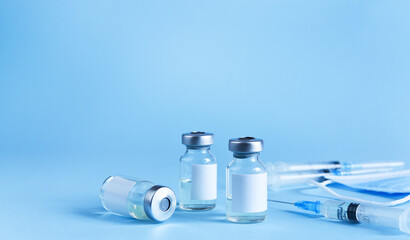 Vaccination against the new Corona Virus SARS-CoV-2: A Syringes and glass vials with liquid. Health...