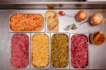 workshop containers full of ingredients for making Argentine empanadas