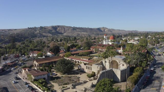 Daytime aerial view of the Spanish Colonial era mission and surrounding city of downtown San Juan Capistrano, California, USA. 
