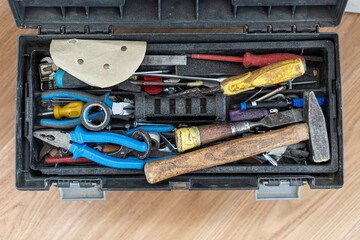 Open tool box with many different tools in it.