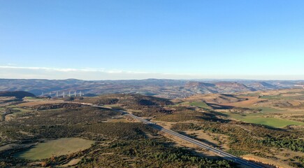 plateau du Larzac, viaduc de Millau et causses de Lozère et de l'Aveyron soleil couchant