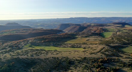 plateau du Larzac, viaduc de Millau et causses de Lozère et de l'Aveyron soleil couchant