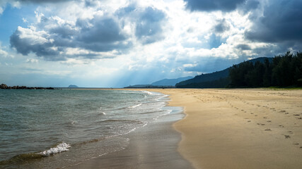 beach with white sand on Hainan Island, sunny weather, summer travel vacation, fluffy white clouds in the sky, travel in China, a beautiful beach with white fluffy clouds in the sky over the sky