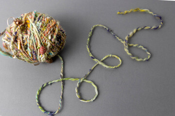 hand spun art yarn with beads and ribbons 