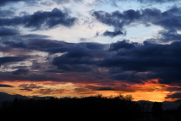 Dramatic dark clouds and a beautiful sunset over the wetlands