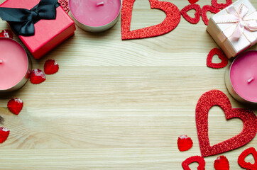 Valentine Day.Holidays.Background, top view, with red hearts, gifts and candles.