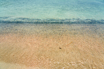 A tropical beach with turquoise water in Crete.