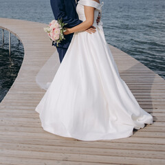 Fototapeta na wymiar Bridal couple happy together, sensual bride and groom. Wedding photography concept.