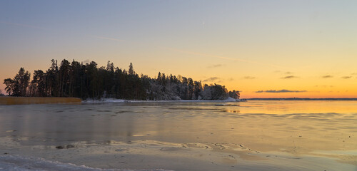 Freezing sea at sunset in the archipelago near Turku Finland.