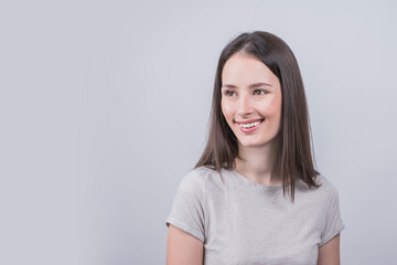 portrait of a young girl smiling on a white background