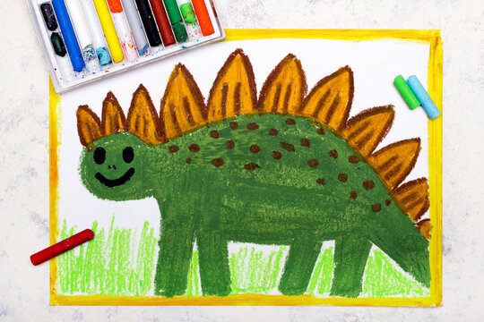 Photo of colorful drawing: Smiling dinosaur. Green weird stegosaurus.