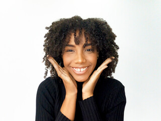 Young African American woman smiling in black t-shirt on white background. foreground