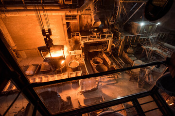 Tank pours liquid metal at the steel mill