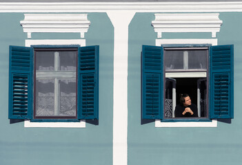 person in front of window