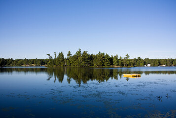 Fototapeta na wymiar Calm lake water shot in Muskoka, Ontario Cottage Country