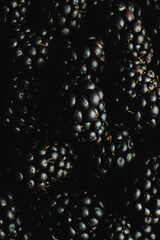 bowl of blackberries on black
