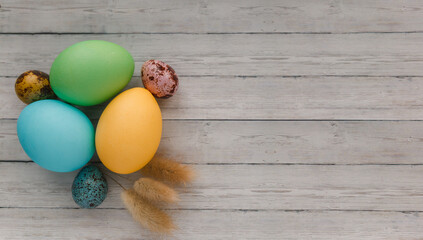 Easter eggs on wooden background and copy space