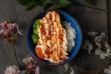 A Bowl of Chicken and Vegetables over Rice