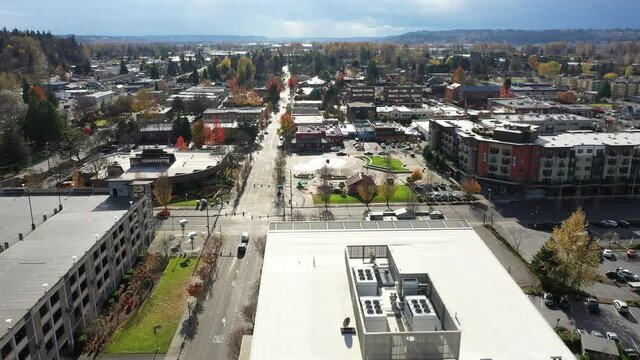 Aerial - drone footage of Kent Station, a shopping area downtown Kent in the Green River Valley near East Hill, Scenic Hill, Auburn, Renton, Federal Way, all suburbs of Seattle, King County Washington