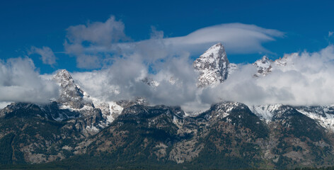 close up of storm clouds clearing from teton mountain range at grand teton national park