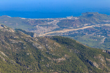 Fototapeta na wymiar View of the Taurus mountains and the Mediterranean sea from a top of Tahtali mountain near Kemer, Antalya Province in Turkey