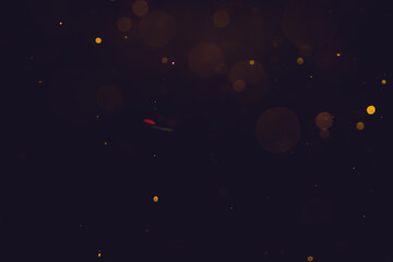 Obraz na płótnie Canvas Dark Abstract Gold bokeh sparkle on black background