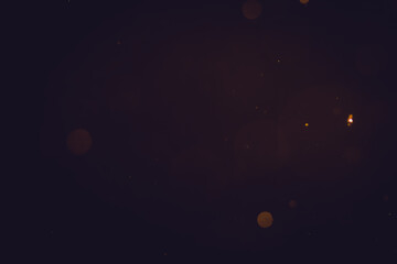 Dark Abstract Gold bokeh sparkle on black background