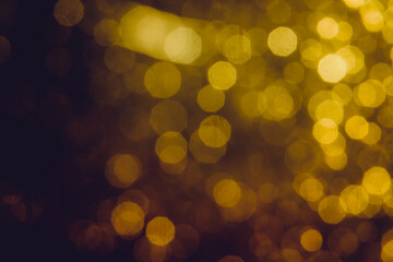 Abstract decorat  bokeh holiday christmas glowing lights on black