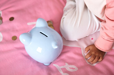 Piggy piggy bank on the sheet and children