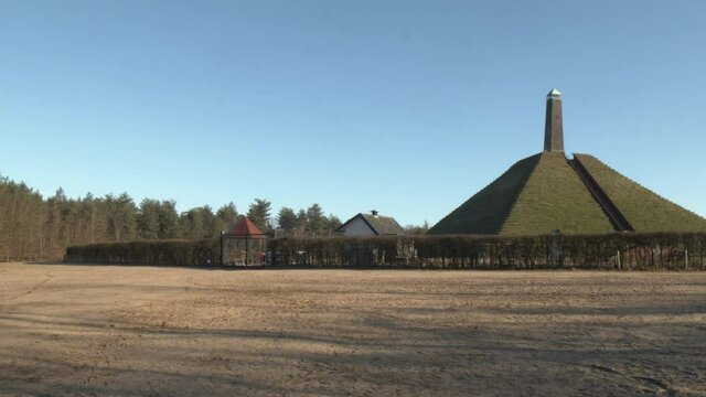 Panning towards Austerlitz Pyramid - wide. The Piramide van Austerlitz is a monument in the Netherlands, built in 1804 as a tribute to Napoleon Bonaparte.