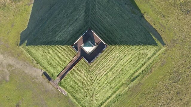 Wide aerial of Austerlitz Pyramid surrounded by forest. The Piramide van Austerlitz is a monument in the Netherlands, built in 1804 as a tribute to Napoleon Bonaparte.