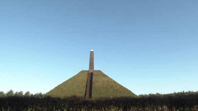 Wide tilt of Austerlitz Pyramid with obelisk on top. The Piramide van Austerlitz is a monument in the Netherlands, built in 1804 as a tribute to Napoleon Bonaparte.