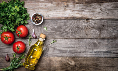 Raw organic vegetables with fresh ingredients for healthily cooking on vintage background, top view, banner. Vegan or diet food concept. Background layout with free text space.