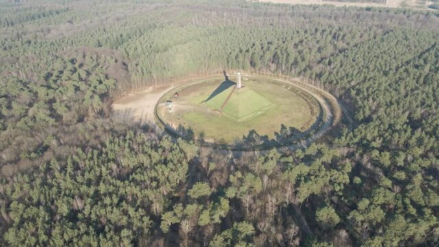 Flying towards Austerlitz Pyramid surrounded by beautiful forest. The Piramide van Austerlitz is a monument in the Netherlands, built in 1804 as a tribute to Napoleon Bonaparte.