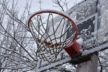 basketball hoop on the street. Snow on basketball hoop