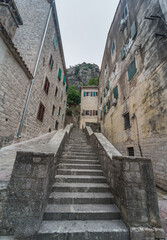 Fototapeta na wymiar Kotor Old Town,steep ancient steps leading up into the surrounding mountains,Kotor municipality,Montenegro.
