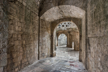 Fototapeta na wymiar Narrow archway in the ancient streets of Kotor Old Town,Montenegro.