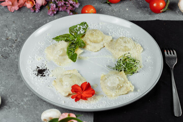 pasta ravioli with meat, tomato and basil