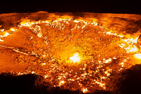 Darvaza Gas Crater in Turkmenistan near Derweze. Flames due to natural gas burning at night. Also know as Darwaza Gates to Hell or Door to Hell.