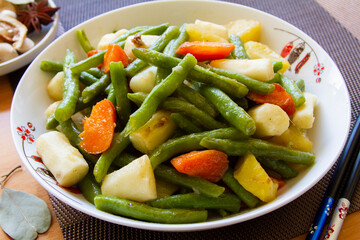 Green beans and potato stir fry close up. Chinese food.
